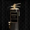 Glasschilderij Gucci brandblusser goud zwart bruin 60x80cm